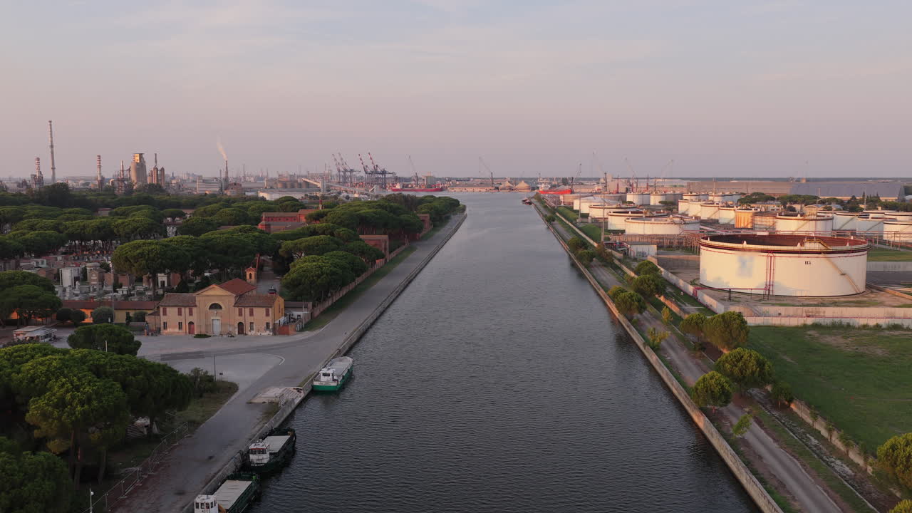 Nice drone view of industrial and port area of Ravenna,production district is made up of a chemical and petrochemical pole, thermoelectric and metallurgical plants at sunset