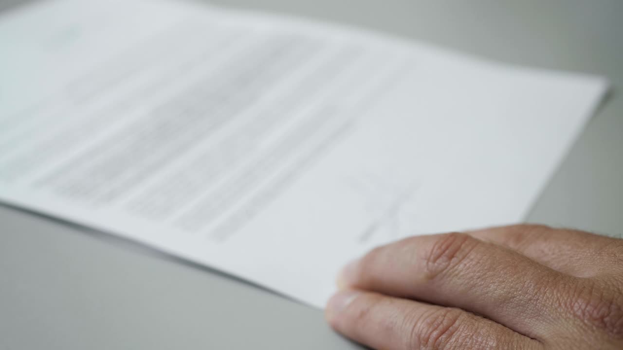 Notary public in office stamping document. Businessman stamping document table, director approving contract, paperwork. Man is approve documents by signing and stamping papers. Closeup. UHD 4K.