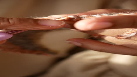 close up of someone crocheting a project