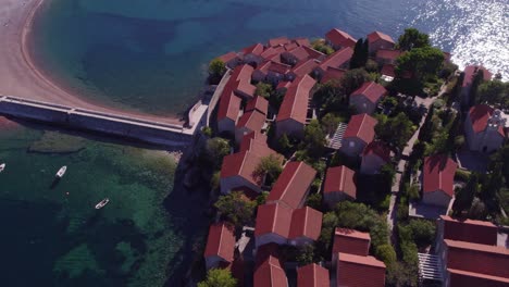 The-famous-Sveti-stefan-resort-at-Montenegro-during-daytime,-aerial