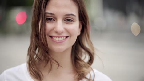 cheerful young woman looking at camera