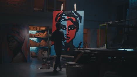 artist painting a portrait in a studio