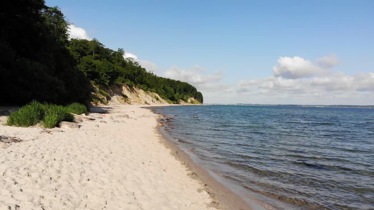 Beautiful beach in northern Germany, Schleswig-Holstein called Noer Beach on the Baltic Sea.Drone flies from right to the left in a low altitude