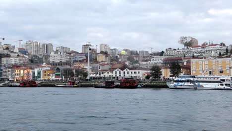 vila nova de gaia by night seen from rabelo boat on douro river