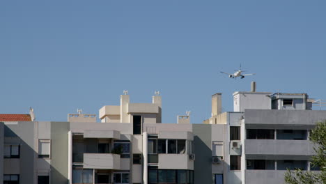 cityscape with airplane in flight