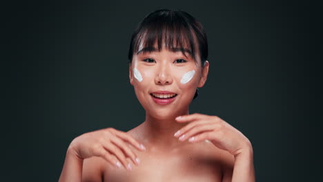 woman applying face cream