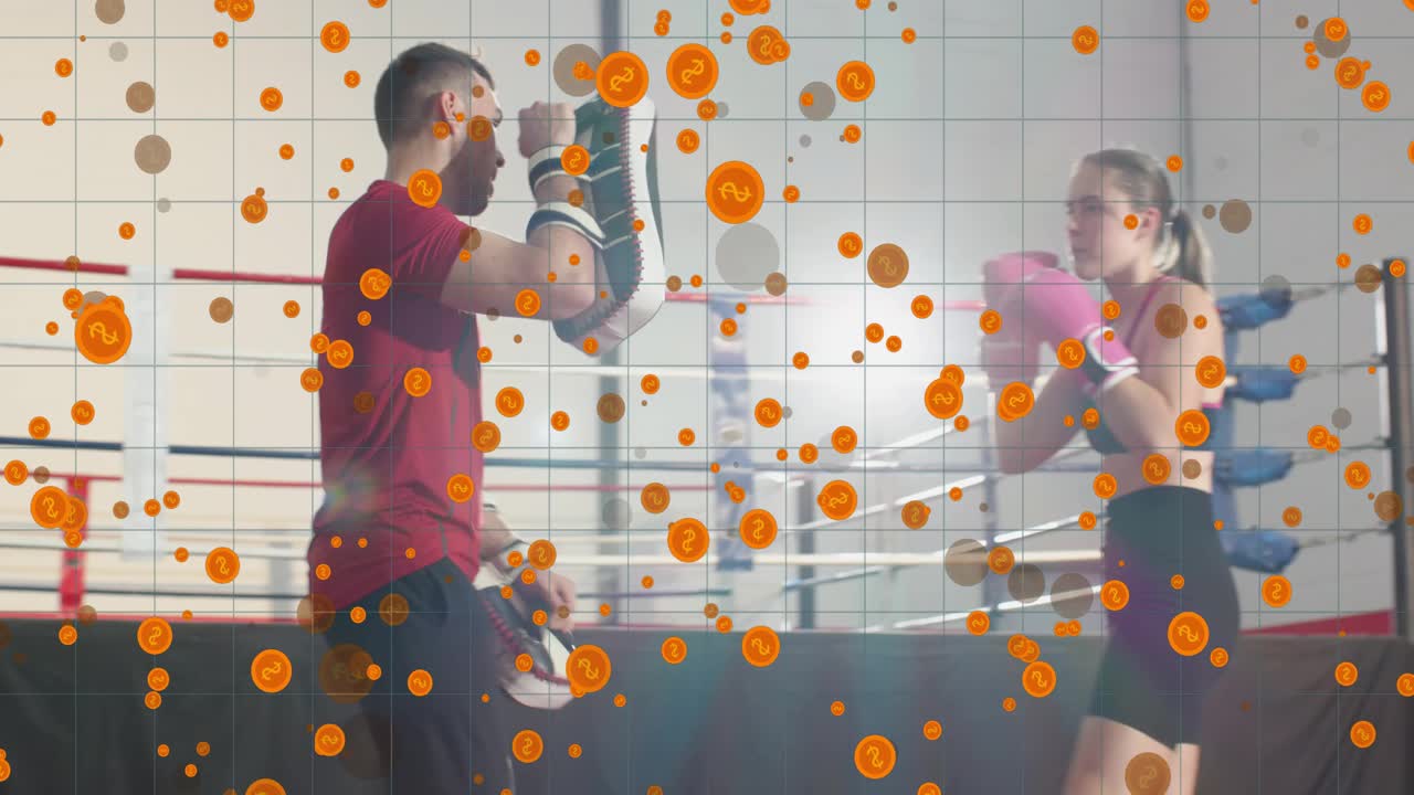 Coach presenting pads, female boxer striking with pink gloves and shield, training boxing technique