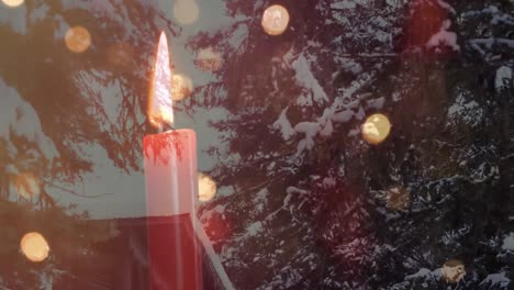 Animation-of-candle,-christmas-fairy-lights-over-winter-scenery