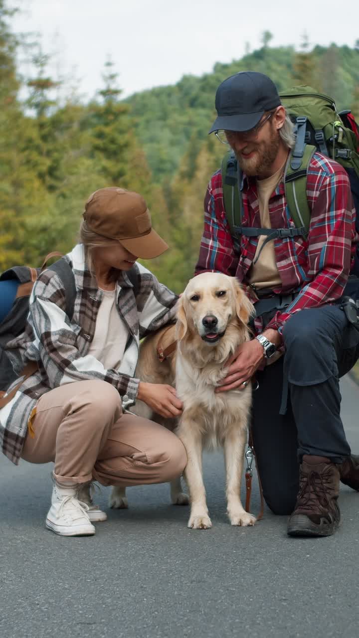 Couple Hiking with Their Dog