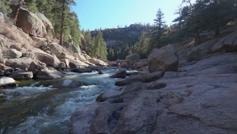 cinematic colorado river fisherman paradise deckers cheesman canyon evergreen conifer boulder shaded mountainside forest peaceful water boulder rocks slow slider movement to the left 4k