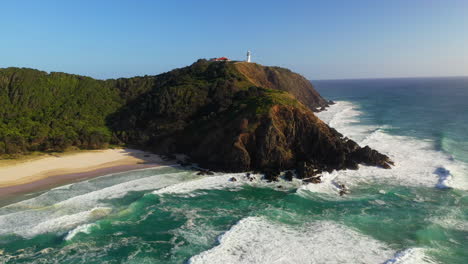 cinematic rotating drone shot of cape byron lighthouse, australia