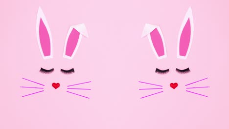 creative double easter bunny on pastel pink background. stop motion