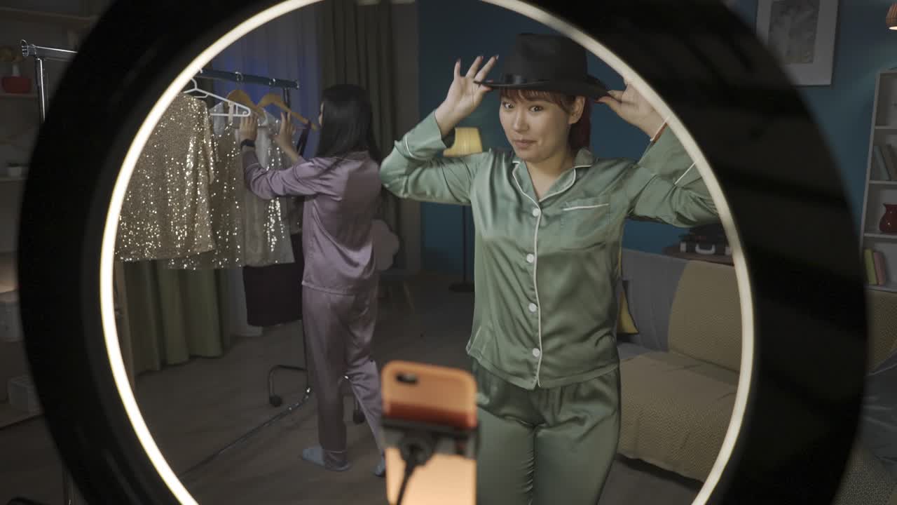 Two Women Modeling Pajamas and Outfits in a Fashionable Video