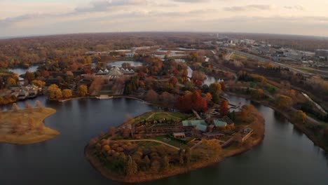 glencoe, illinois : aerial drone backward moving shot over chicago botanic garden with beautiful lakes during evening time