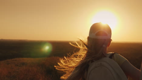 A-Carefree-Child-With-A-Knapsack-Behind-Him-Runs-Towards-The-Sun-Summer-Holidays-And-Freedom-Concept