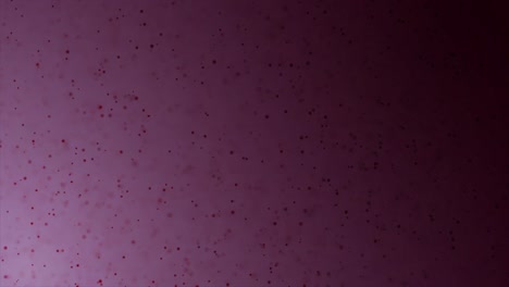 fondo púrpura abstracto con partículas rojas