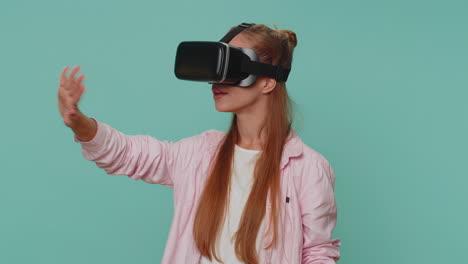 excited girl using headset helmet app to play simulation game, watching virtual reality 3d 360 video