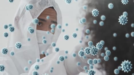 animación de células de coronavirus sobre médico de raza mixta con máscara facial tomando la temperatura