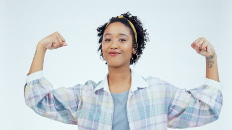 Arm,-flex-and-woman-face-in-studio-happy