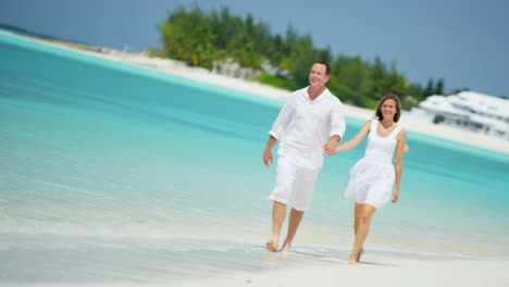 attractive caucasian couple enjoying their vacation on beach