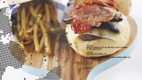 burger with bacon and fries on wooden board over digital data animation