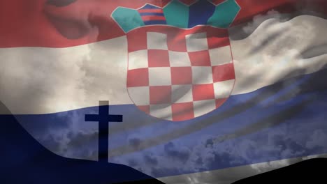 animation of waving croatia flag against silhouette of a cross on mountain against clouds in the sky