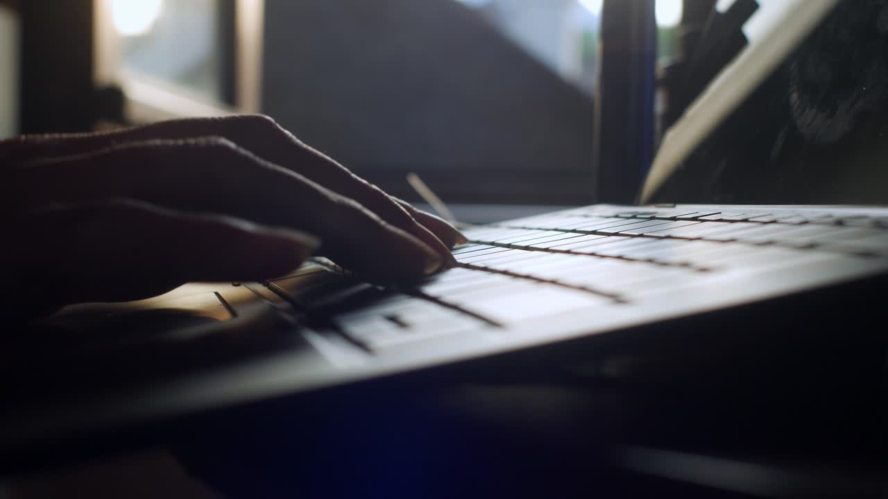 Hazy dramatic typing, keyboard dusk