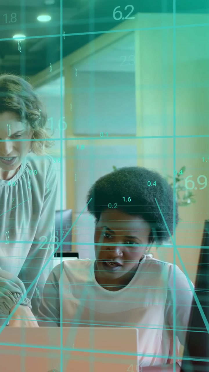 Vertical video: Mentor leaning in, pointing at laptop, mentee typing, teal overlay guiding business