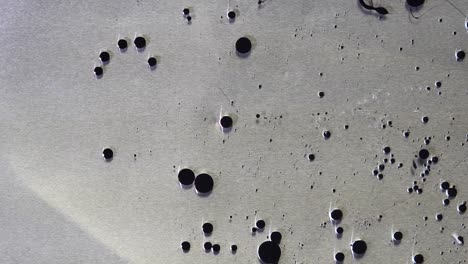 metal surface with dark spots