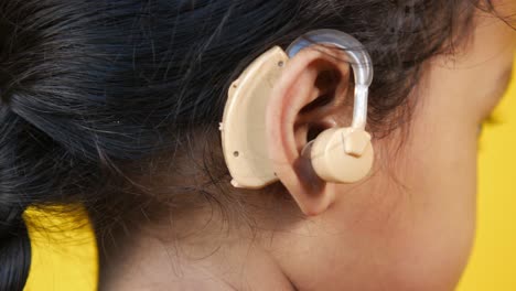 child with hearing aid