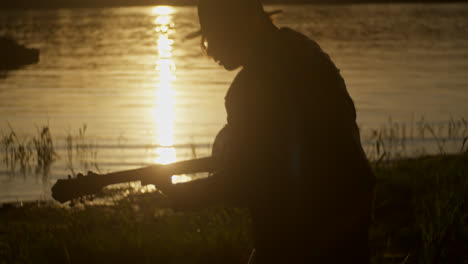 sunset guitar performance by the river
