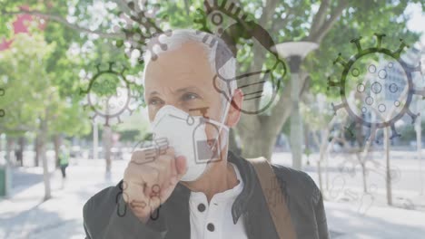 animation of covid 19 cells over senior man wearing face mask