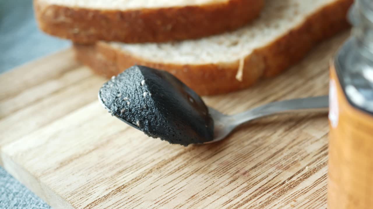 Black sesame spread on a bread ,