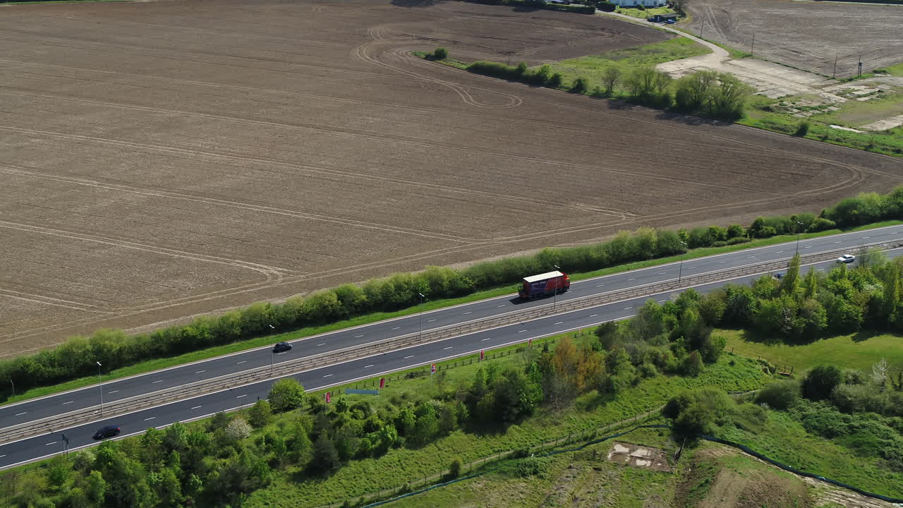 Aerial view tracking a lorry on the A229 Herne Bay, with a pan up reveal of the Kentish countryside.