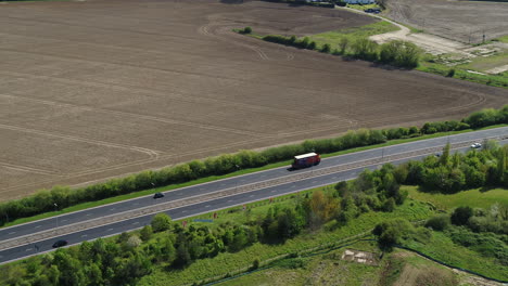 aerial view tracking a lorry on the a229 herne bay, with a pan up reveal of the kentish countryside.