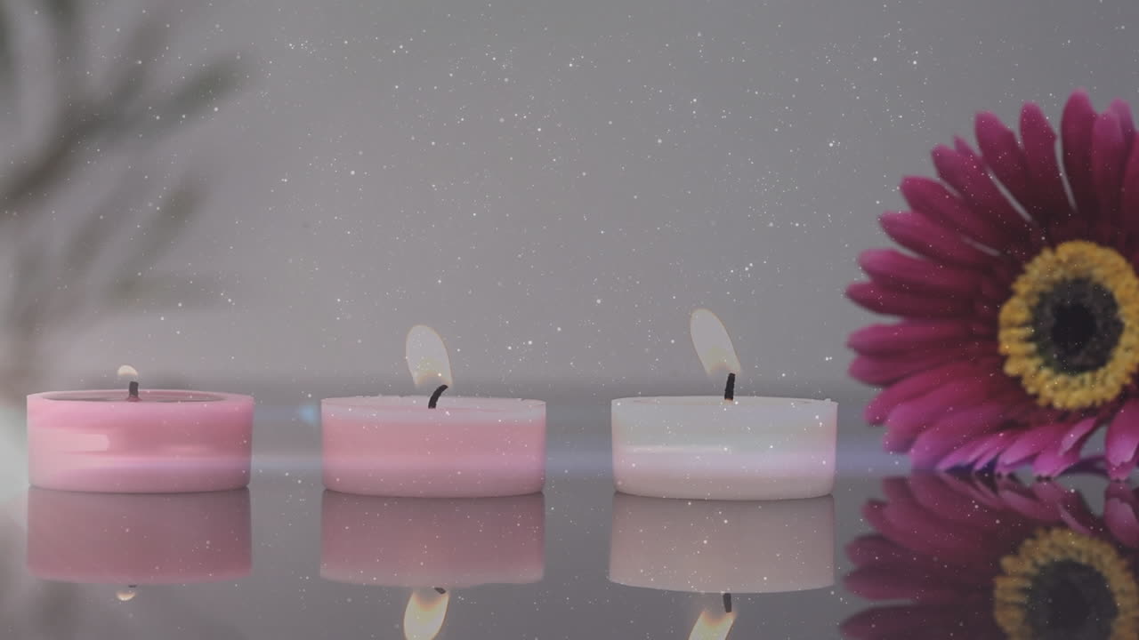 Animation de points lumineux sur des bougies et une fleur