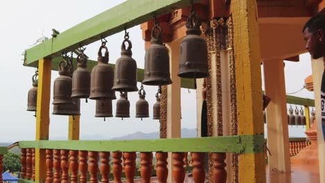 time lapse the people hitting the bells by wood at temples in thailand. buddhist beliefs for good luck.