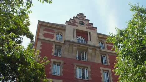 red brick apartment building with stone trim
