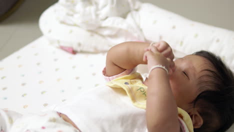 engaging baby girl expressing emotions through sounds, seeking attention and playful interaction, highlighting important developmental milestones in early childhood