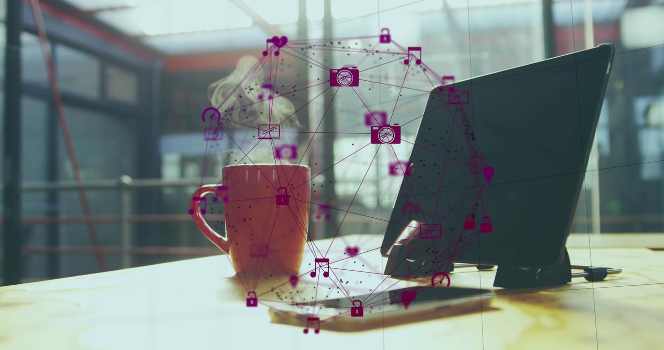 Animation of globe of digital icons over laptop, smartphone and coffee cup on wooden table