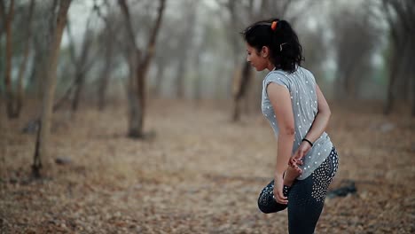 young womans doing yoga, how yoga can drastically improve your gut health