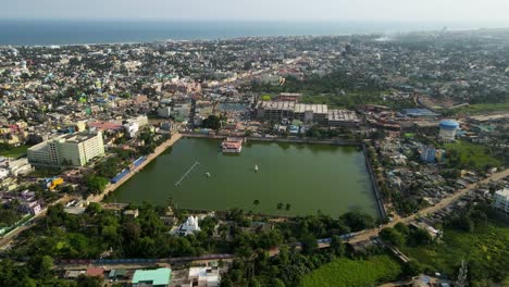 high-altitude aerial drone shot of jagannath puri, featuring the grand temple and the bustling life of the city below.