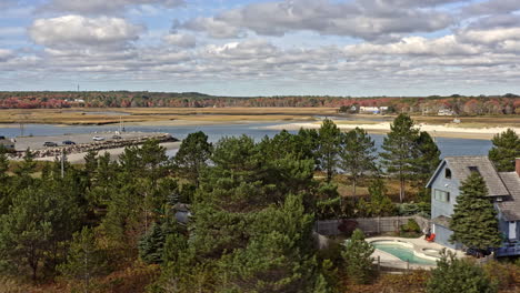 wells maine aerial v1 beautiful landscape shot, drone fly around wells harbor capturing the sea wall, drakes island beach and seaside holiday homes at daytime - october 2020