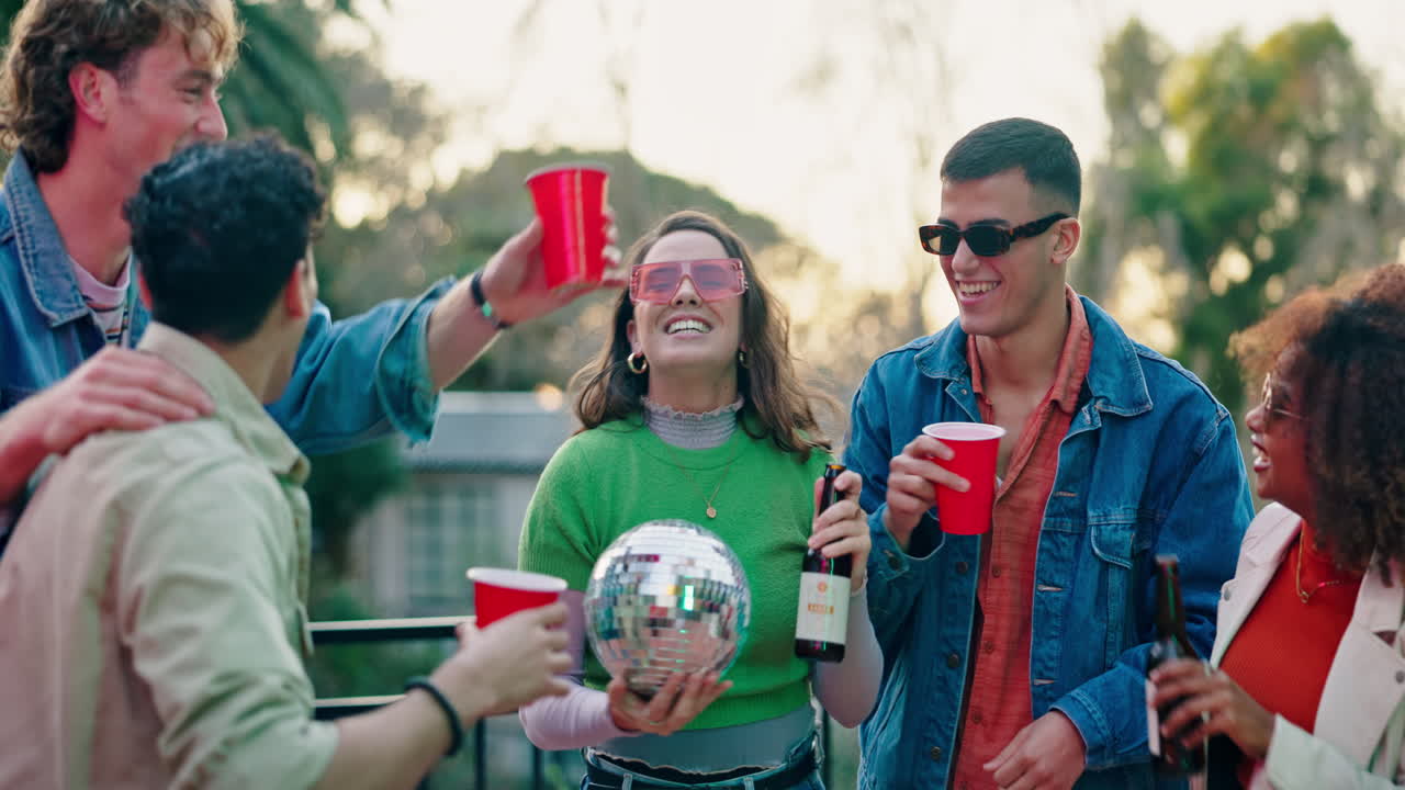 Group of friends celebrating with drinks outdoors