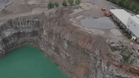 Drone-flies-over-a-quarry-in-the-Midwestern-USA-and-looks-down-on-cool-dirt-formations