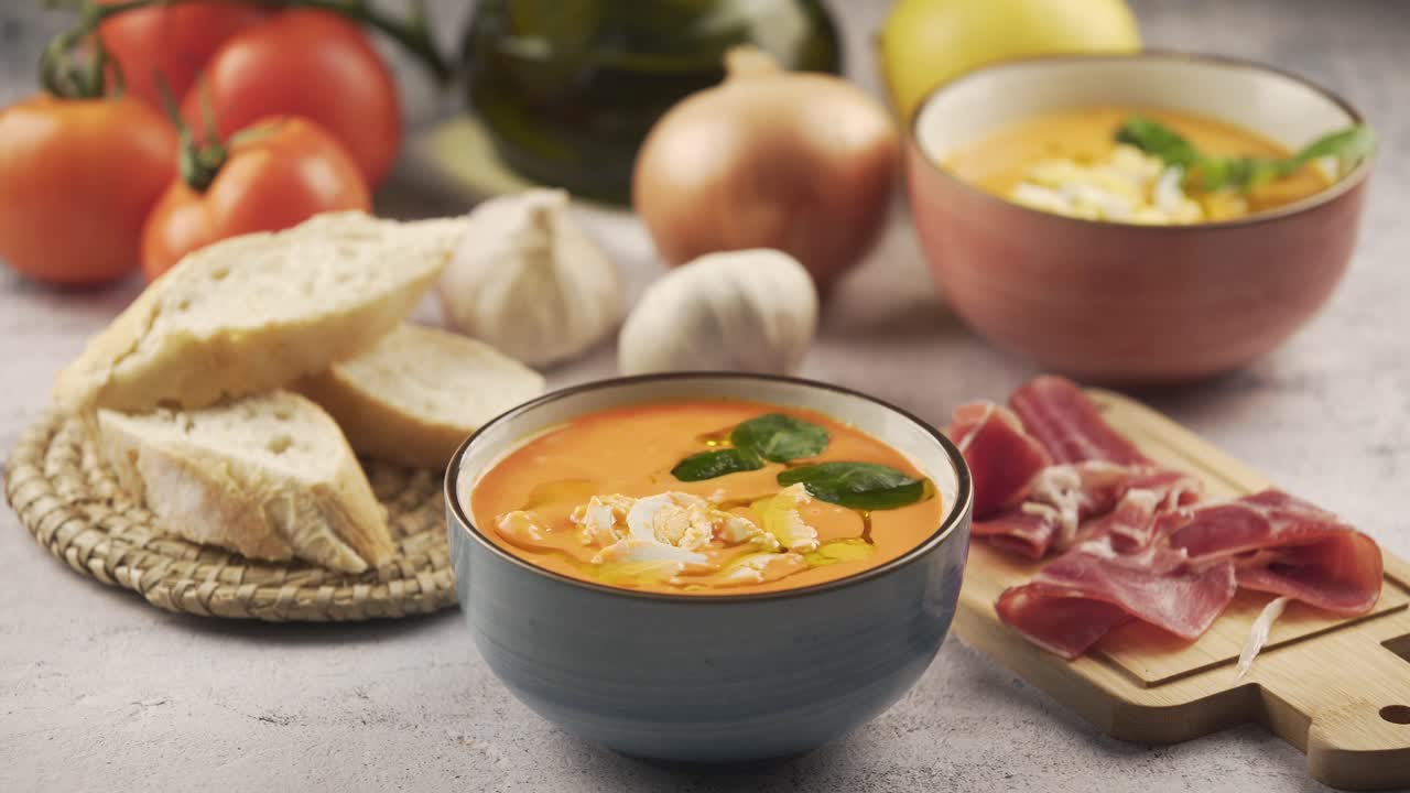 Eating salmorejo with bread and serrano ham