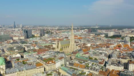 wide aerial orbiting shot around st stephen's cathedral in vienna, austria's capital city