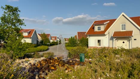 luxury empty and abandoned suburb residential area with houses and a fountain