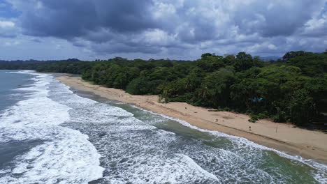 Aerial-panorama-of-Gandoca-Manzanillo's-coastline,-blending-azure-waters