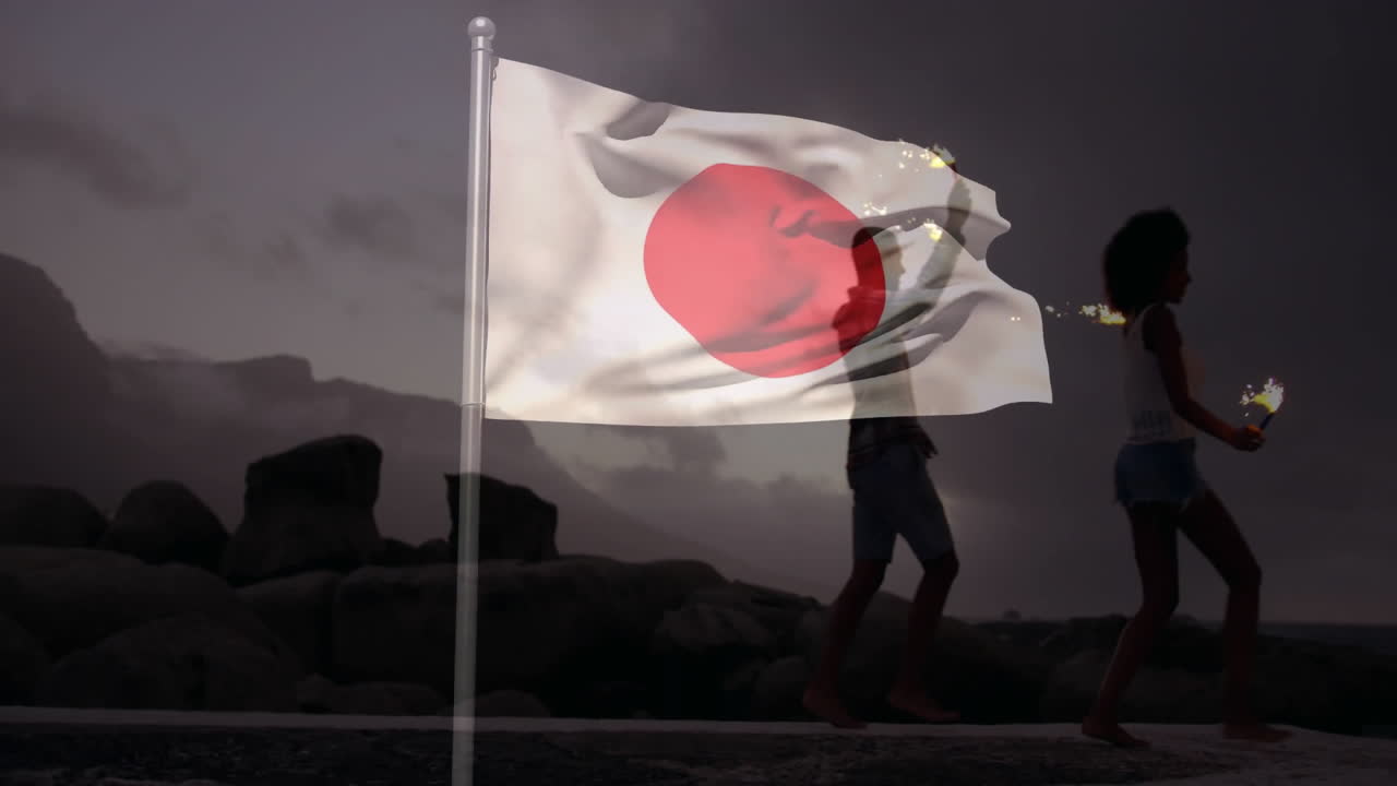 Waving Japanese flag over silhouette of people walking on rocky landscape animation